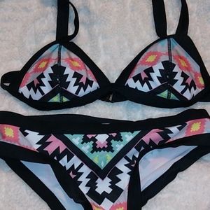 geometric swimsuit. size small but fits bigger
